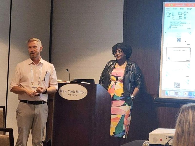Terry Sweeney speaking beside a co-presenter at a CRC session in New York